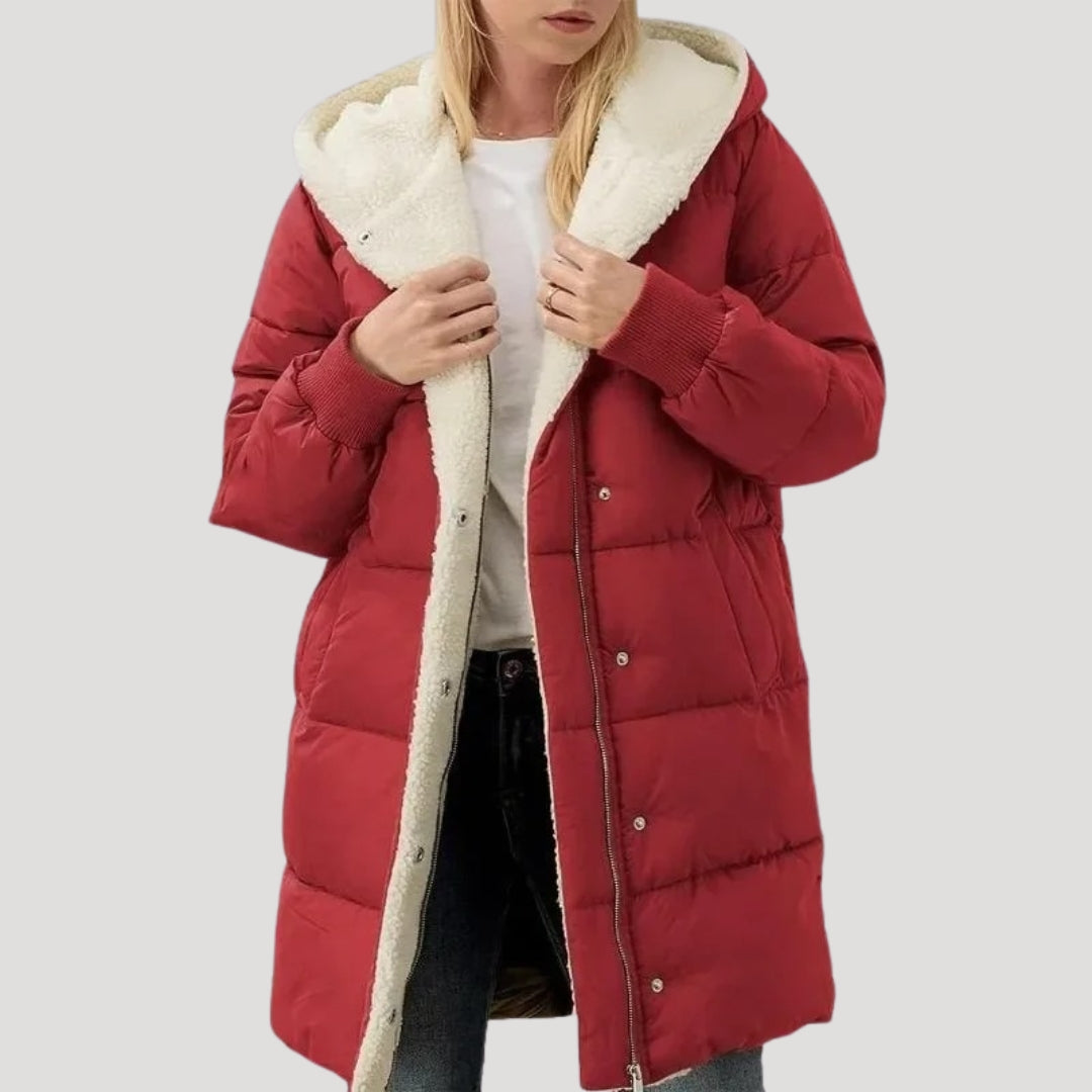 Red Olivia hooded puffer jacket for women by Christine Brewer, featuring a faux fur-lined hood and quilted insulation.
