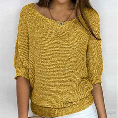 Cream-colored knit sweater for women by Christine Brewer, featuring a stylish and cozy design suitable for summer wear.