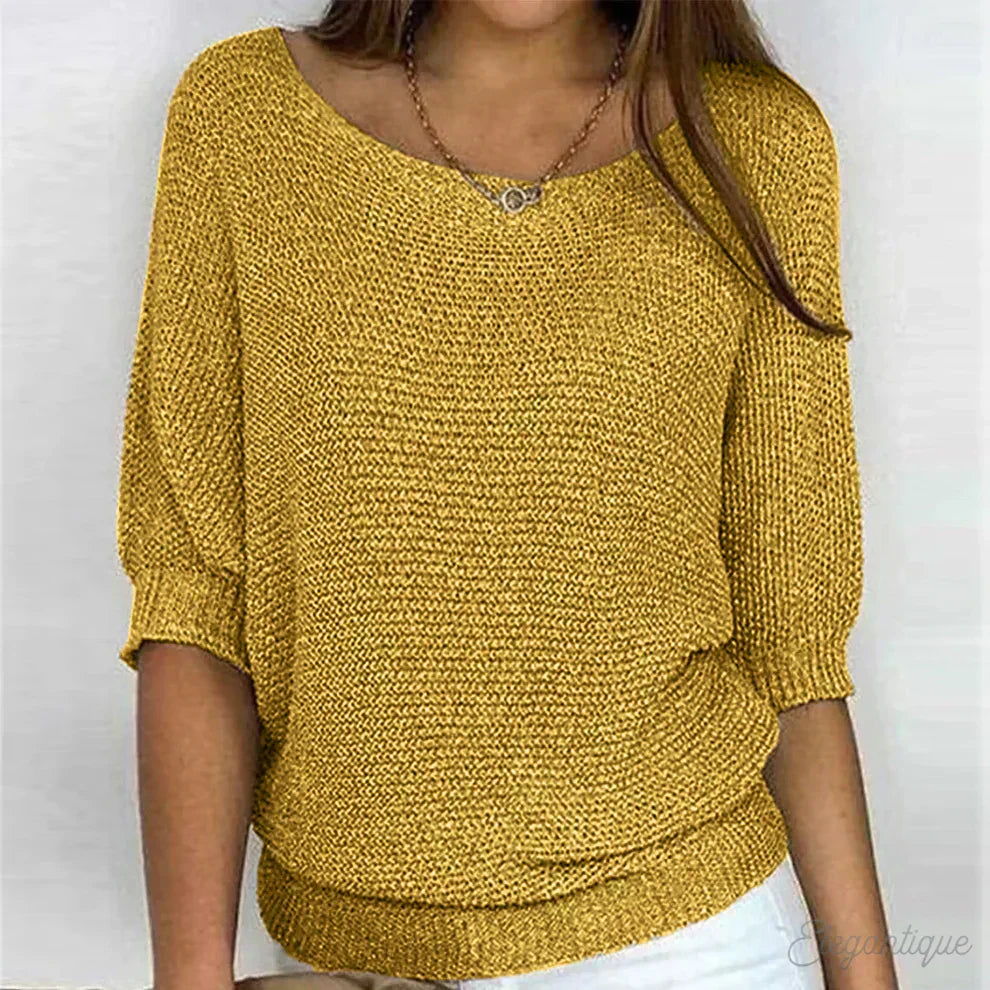 Cream-colored knit sweater for women by Christine Brewer, featuring a stylish and cozy design suitable for summer wear.
