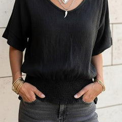 Christine Brewer Ella V-Neck T-Shirt for women, soft fabric, fitted style, in a neutral color, displayed on a hanger.