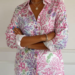 Floral graphic blouse for women by Christine Brewer featuring a vibrant lily and floral print on lightweight fabric.