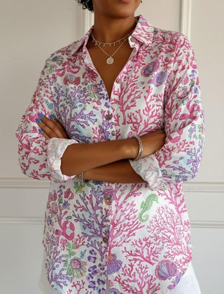 Floral graphic blouse for women by Christine Brewer featuring a vibrant lily and floral print on lightweight fabric.
