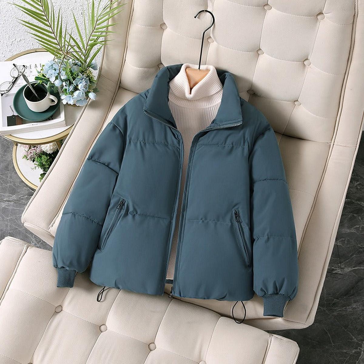 Blue Ava quilted puffer jacket for women by Christine Brewer, showcasing its stylish quilted design and cozy fit.