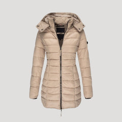 Beige Isabella long puffer jacket for women by Christine Brewer, featuring a padded, insulated design perfect for cold weather.