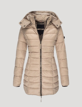 Beige Isabella long puffer jacket for women by Christine Brewer, featuring a padded, insulated design perfect for cold weather.
