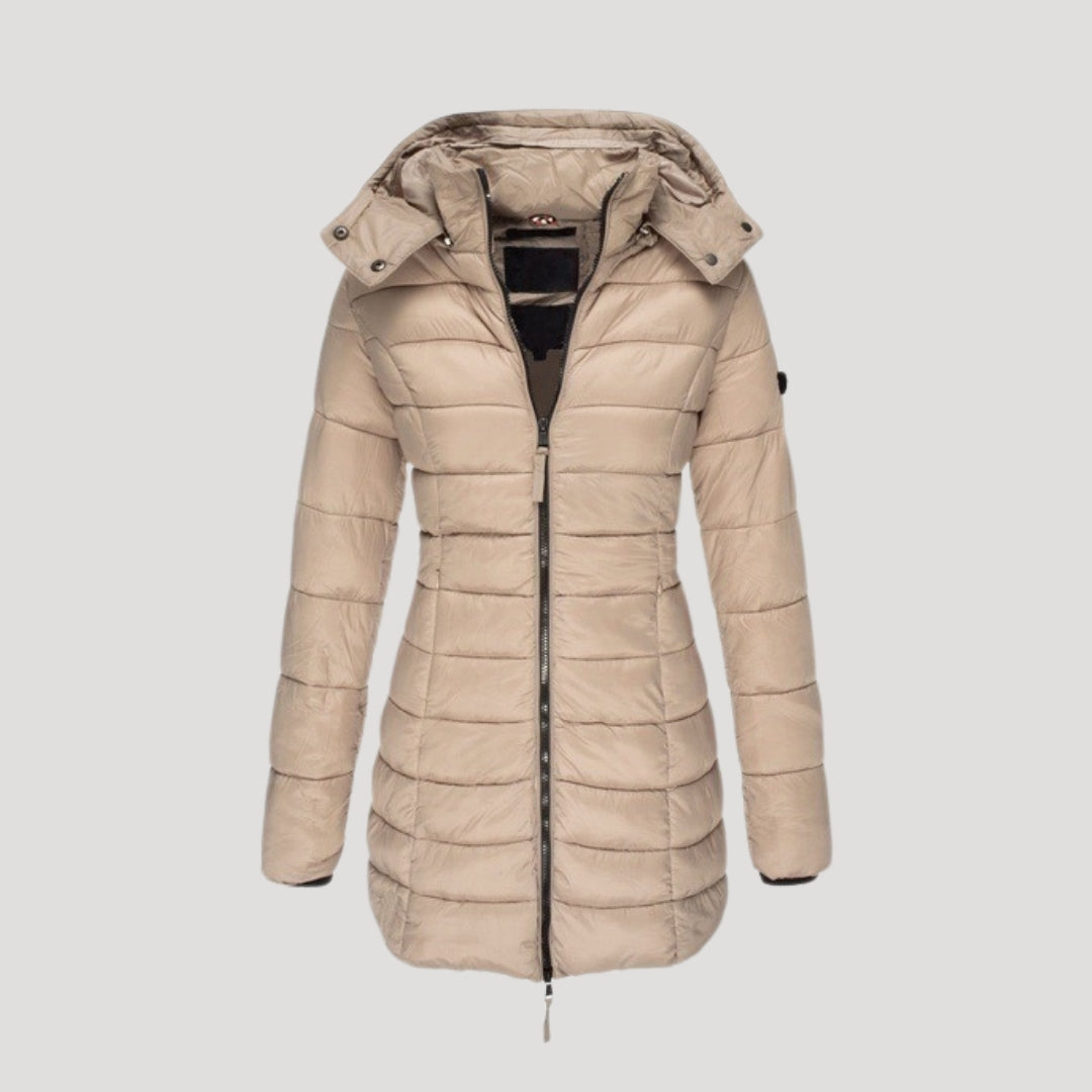 Beige Isabella long puffer jacket for women by Christine Brewer, featuring a padded, insulated design perfect for cold weather.