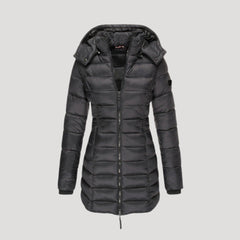 Black Isabella long puffer jacket for women by Christine Brewer, shown on a model, highlighting its padded, warm design.