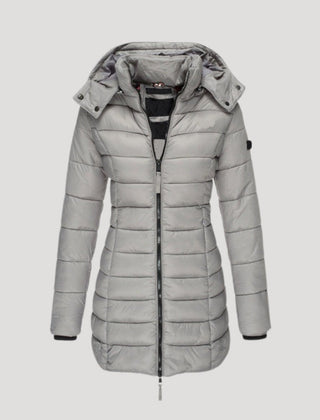 Gray Isabella long puffer jacket for women by Christine Brewer, showing a stylish, insulated winter coat with a high collar.