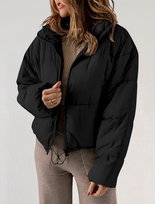 Black Emma high collar puffer jacket for women by Christine Brewer, featuring a stylish, insulated design with a high neckline.