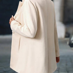 Women’s longline blazer jacket by Christine Brewer featuring a stand collar and button-front design.