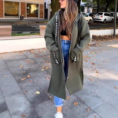 Women wearing the Isla oversized hooded long coat by Christine Brewer, zip-up fleece outerwear with a relaxed, longline fit.
