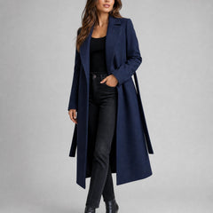 Women’s belted wool-blend long lapel trench coat by Christine Brewer, shown on a model with classic design and tailored fit.