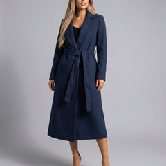 Women's belted wool-blend long-line trench coat with lapel collar, stylish overcoat by Christine Brewer.