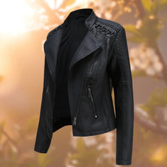 Women’s biker-style zip-up faux leather jacket by Christine Brewer, showing the sleek black design and silver zipper details.