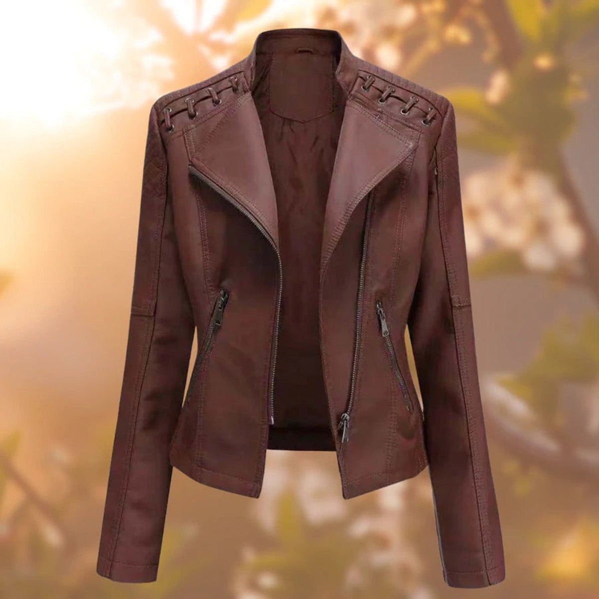 Women's faux leather biker-style zip-up jacket by Christine Brewer, showcasing a sleek black design with silver zipper details.