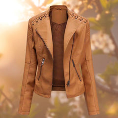 Women's black faux leather biker-style zip-up jacket by Christine Brewer, featuring a sleek design and silver hardware.