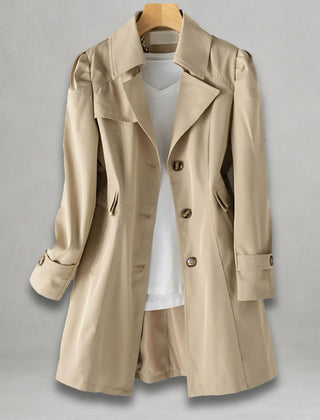 Women’s classic fit single-breasted trench coat with notch lapel, by Christine Brewer, shown on a model.
