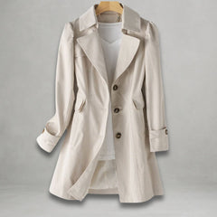 Women’s classic fit single-breasted trench coat with notch lapel by Christine Brewer, shown in a neutral color on a model.