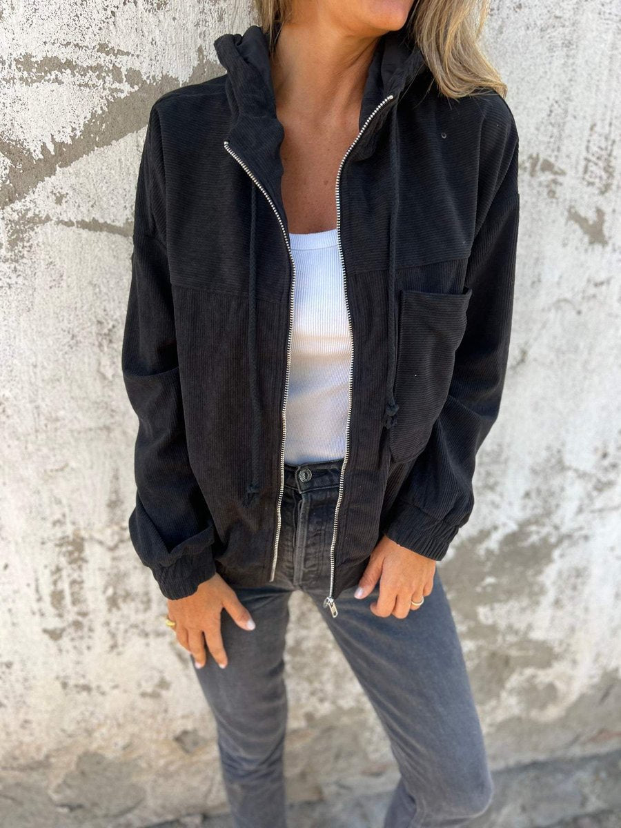 Women's oversized corduroy hooded zip-up jacket by Christine Brewer, showcasing the casual, relaxed fit and textured fabric.