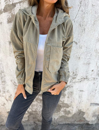 Women's oversized corduroy hooded zip-up quilted jacket by Christine Brewer, featuring a cozy, stylish fit and textured fabric.