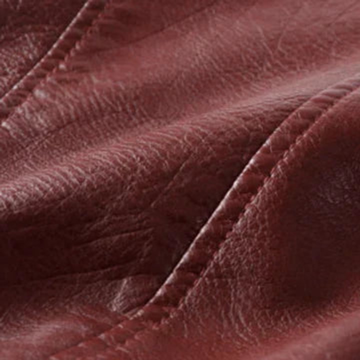 Women’s cropped biker faux leather jacket by Christine Brewer with front zip closure and stylish design.