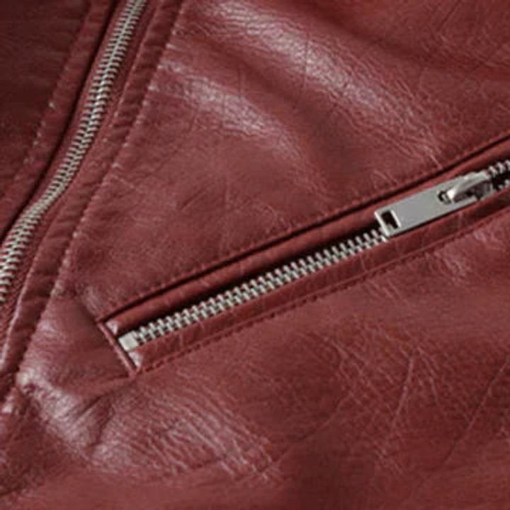 Women's cropped faux leather biker jacket with zip-up front by Christine Brewer, featuring a stylish, fitted design and classic biker details.