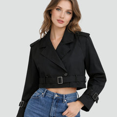 Women's cropped double-breasted belted trench coat by Christine Brewer, shown on a model with a classic beige finish.