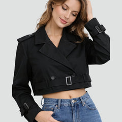 Women's cropped double-breasted trench coat by Christine Brewer featuring a belted waist and classic trench style.