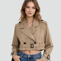 Women's cropped double-breasted belted trench coat by Christine Brewer, shown with classic trench design and tailored fit.