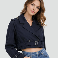 Women's Madison Cropped Double-Breasted Belted Trench Coat by Christine Brewer, shown on model with classic trench design and belt details.