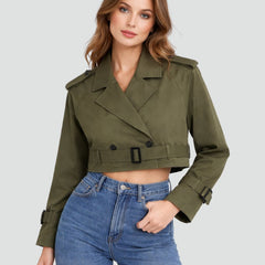 Women's cropped double-breasted belted trench coat by Christine Brewer, shown in beige with classic lapels and waist belt.