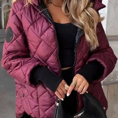 Women's diamond quilted hooded zip-up puffer jacket by Christine Brewer, shown in black with front zipper and hood.