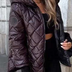 Women's Sienna diamond quilted zip-up hooded puffer jacket by Christine Brewer, featuring a stylish quilted design and cozy hood.