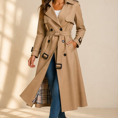 Emily women's double-breasted belted long trench coat by Christine Brewer, shown in a stylish beige fabric with a classic silhouette.