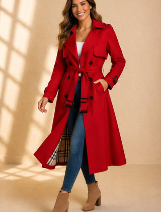 Emily women's double-breasted belted long trench coat by Christine Brewer, shown on a model with classic beige fabric and waist belt.