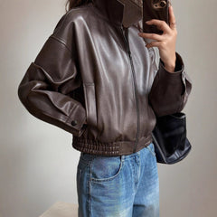 Scarlett women's faux leather bomber jacket by Christine Brewer, zip-up style with long sleeves, black and fitted silhouette.