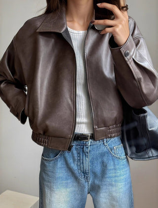 Scarlett women's faux leather bomber jacket with zip-up front and long sleeves, stylish outerwear by Christine Brewer.