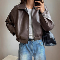 Victoria women's faux leather bomber jacket with zip-up front and long sleeves, featuring a sleek, stylish design by Christine Brewer.