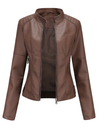 Women's faux leather moto jacket by Christine Brewer featuring a stand collar and zip-up front.