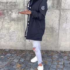 Women’s hooded drawstring midi parka coat by Christine Brewer, casual style with front pockets and adjustable waist.
