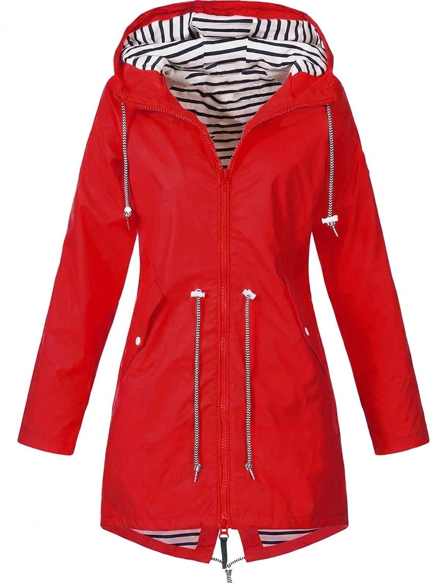 Woman wearing Christine Brewer Victoria waterproof rain coat with hood and drawstring, designed for rainy weather.