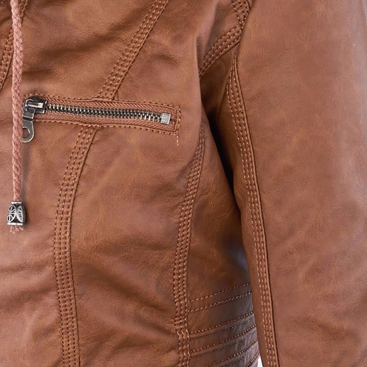 Charlotte women's hooded faux leather moto coat with a removable hood, by Christine Brewer, shown on a model.