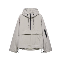 Women's quilted hooded pullover anorak jacket with half-zip from Christine Brewer, featuring a cozy hood and stylish design.