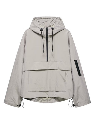 Women’s quilted hooded pullover anorak jacket by Christine Brewer, windproof with half-zip and cozy design.