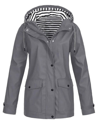 Women's Eleanor waterproof rain coat by Christine Brewer with hood, striped lining, and zip-up front for rainy weather protection.