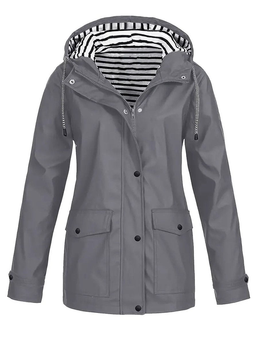 Women's Eleanor waterproof rain coat by Christine Brewer with hood, striped lining, and zip-up front for rainy weather protection.