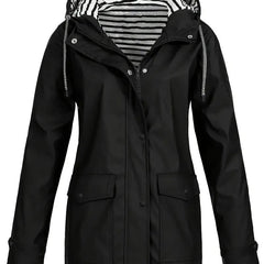 Women's waterproof rain coat with hood, striped lining, and zip-up front by Christine Brewer, designed for rainy weather.
