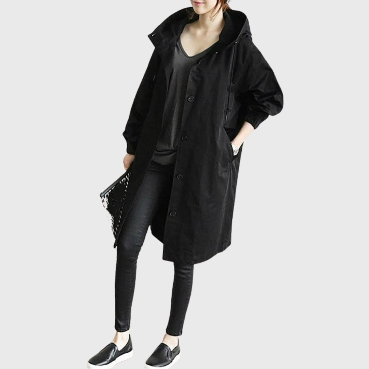 Women’s hooded water-repellent oversized long trench coat by Christine Brewer, shown in a stylish, long silhouette with a hood.