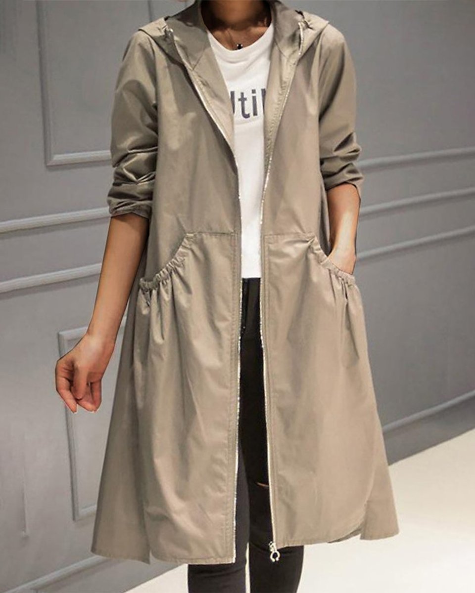 Women’s waterproof long trench coat with hood and zip-up front by Christine Brewer, designed for rain protection and stylish layering.