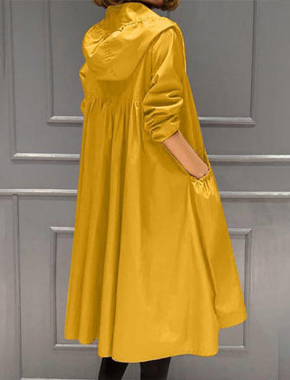 Women's waterproof long trench coat with hood and zip-up front by Christine Brewer, designed for rain protection and style.